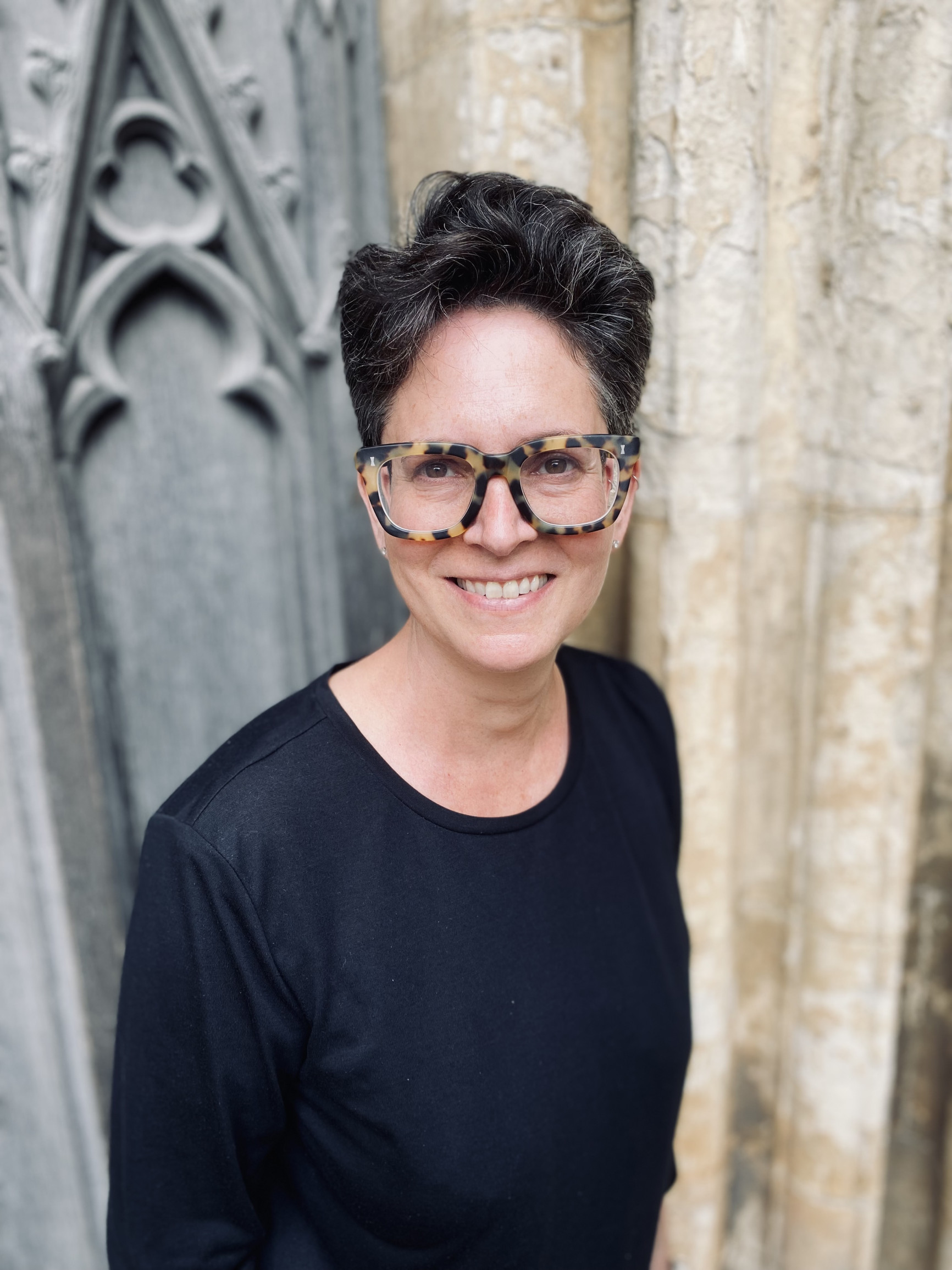 Portrait of Erica Wagner against church window